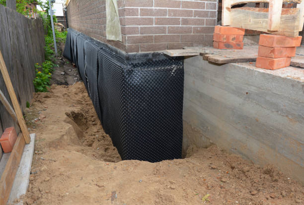 SJ Waterproofing Pros technician performing targeted Emergency Waterproofing assessment in Monroe, OH